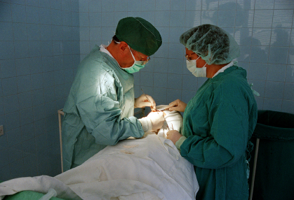 doctor working on patients mouth