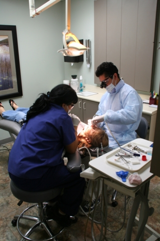 doctor working on patients mouth