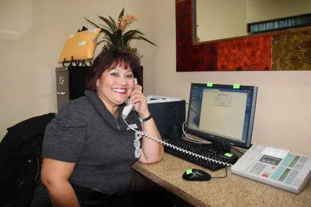 staff member of Inland Dental Center – San Bernardino on the phone